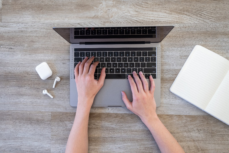 A person typing on a computer